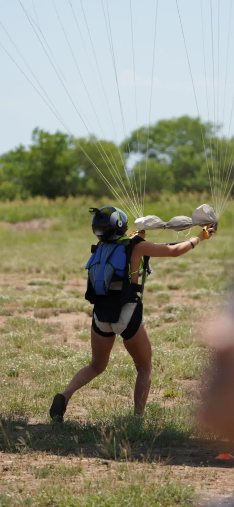 Catching the canopy lines after landing — action shot
